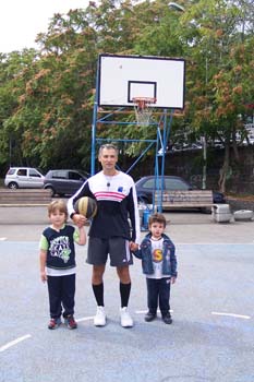 Alessamdro playing at basket with his nephews